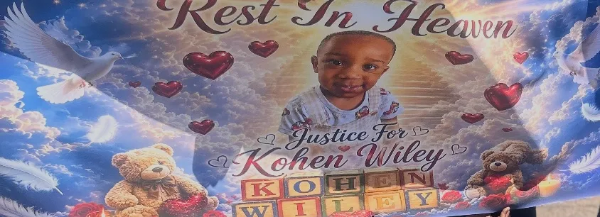 Memorial poster for Kohen Wiley: Rest in Heaven, Justice for Kohen Wiley, with doves, hearts, and toy blocks spelling his name